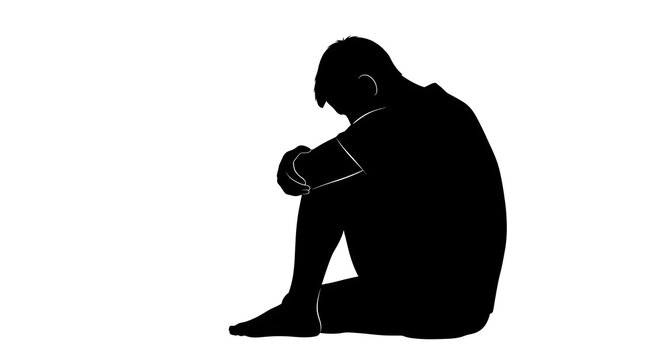 Silhouette of a person sitting with head down and arms around legs on a white background space for text