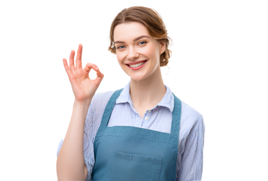 Happy young woman showing ok gesture in front of transparent background wearing shirt and apron