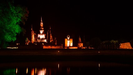 Fototapeta premium Picture of Sukhothai Historical Park at night with beautiful lights