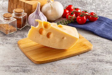 Yellow maasdam cheese triangle piece