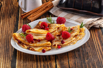 Sweet homemade pancakes with raspberry