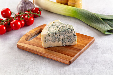 Blue cheese piece over board