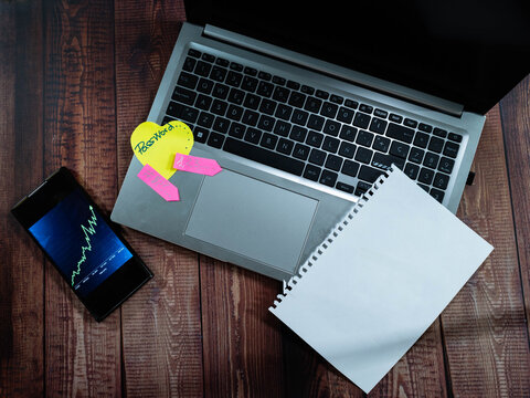 Laptop security finance graph sticky note desk copy space.