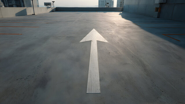 A minimal rooftop parking expanse with a single painted arrow pointing forward on unbroken concrete