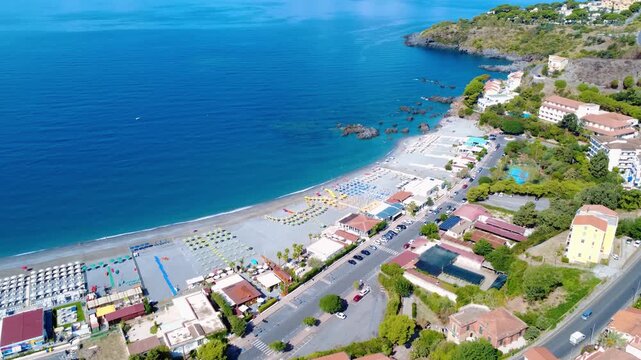 Breathtaking Aerial View of a Tranquil Seaside Village With Beach and Vibrant Coastal Life. Scalea, Calabria, Italy