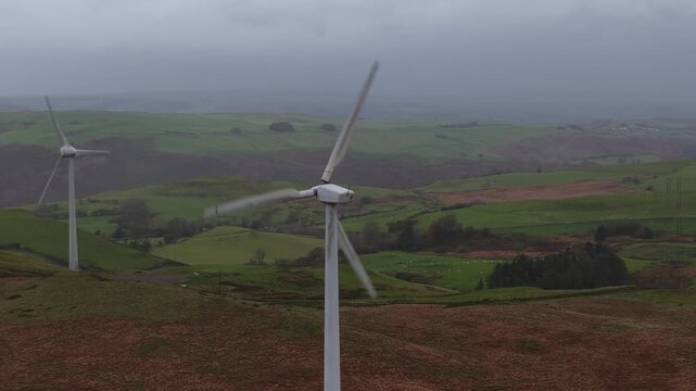 ind turbine in a Wales mountain landscape under cloudy weather