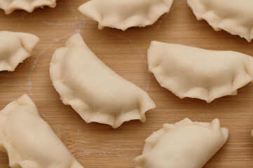 Perfect traditional handmade dumplings on a pastry board