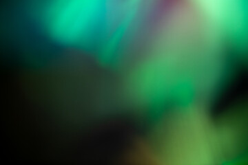 light leak overlay effect with green blurred light ,retro noisy film texture light leak flare on black background,abstract background with ray,grunge old film burn background