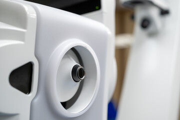 A close-up view of the illuminated laser arm aperture on the ZEISS VISUMAX 800, which is the precise docking and connection point for the disposable suction cap (contact glass) used in refractive