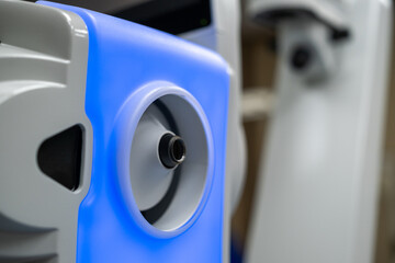 A close-up view of the illuminated laser arm aperture on the ZEISS VISUMAX 800, which is the precise docking and connection point for the disposable suction cap (contact glass) used in refractive