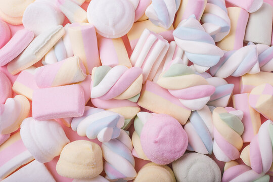 Soft pastel marshmallow texture filling the entire frame. Sweet candy pattern ideal for backgrounds, packaging, and playful designs. 