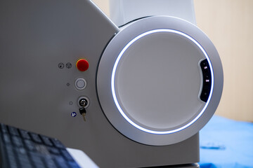 A close-up view of the operational control panel on the main unit of the ZEISS VISUMAX 800 Femtosecond Laser System, featuring the emergency stop, key lock, and a prominent illuminated ho
