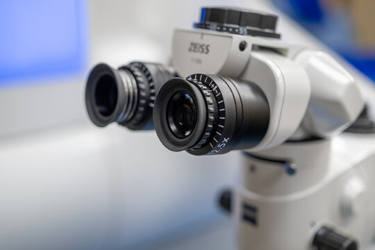 A close-up view of the ZEISS surgical microscope component, including the binocular eyepieces and objective lens, integrated into an advanced femtosecond laser system for ophthalmological refractive
