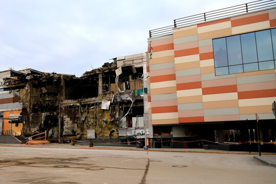 Dnipro, War in Ukraine, missile strike by Russians on shopping center, store, civilian building in Ukraine. Russians burned and destroyed building. War, destruction of houses. - Powered by Adobe