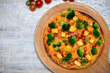 Freshly Baked Broccoli Pizza Served on a Wooden Pizza Board
