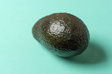 Ripe Avocado on a Bright Turquoise Background