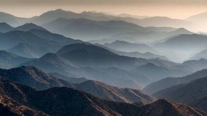 Vast mountain ridge in ontario, california shrouded in morning haze with layered peaks and serene wilderness views