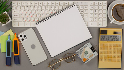 Business and accounting supplies arranged in a composition on an office desk. Top view.