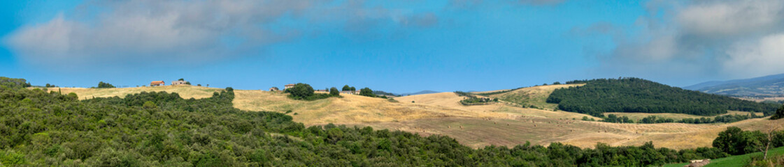 scenic typical tuscany landscape near Volterra with hilly landscape and rural fields