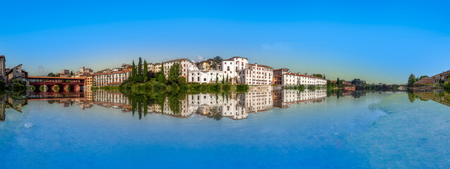 Naklejka premium view to historic skyline of Bassano del Grappa with the Old wooden Bridge, also called ponte degli Alpini, Italy