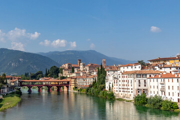 Obraz premium view to historic skyline of Bassano del Grappa with the Old wooden Bridge, also called ponte degli Alpini, Italy