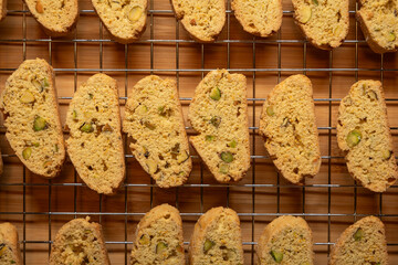 Warm Festive orange and pistachio Biscotti Cooling on a Wire Rack