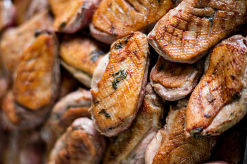Seared duck breasts shine with flavor, featuring a tempting texture and golden hue