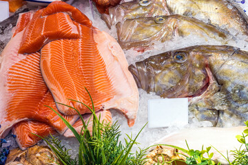 Salmon fillet and John Dory fish for sale at a market in London