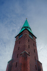 Historic Church Spire Silhouette Against Blue Sky - Danish Architecture