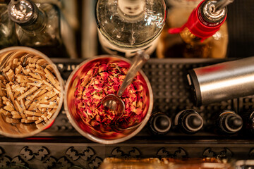 Top-down view of cocktail ingredients arranged on a bar, ready for mixing and preparation.