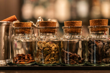 Cocktail ingredients in a bar, captured in moody, atmospheric low light, ready for mixing.