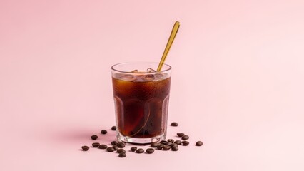 Refreshing cold brew coffee beverage with ice and stirring stick on pastel