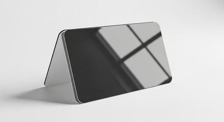 Glossy laminated business card mockup shining professionally on smooth plain white presentation surface