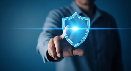 Businessman touching a glowing blue shield icon, representing cybersecurity and data protection in a digital world