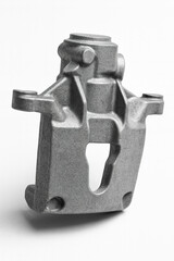 Raw cast steel support component, unpolished industrial metal part isolated on white background