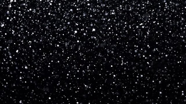 Abstract background featuring glittering particles, snow-like sparkles, and soft lighting effects against a dark backdrop, with a subtle grainy texture