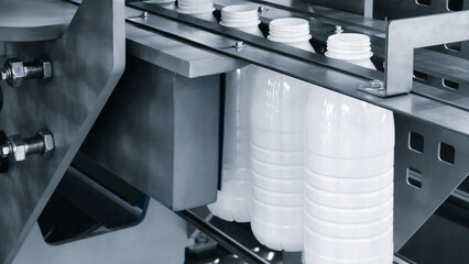 Machine for producing plastic beverage bottles using extrusion method from plastic preformed PET...