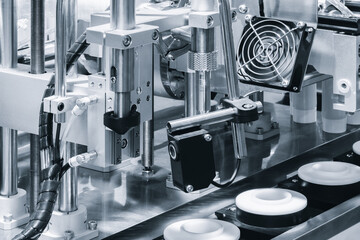 Conveyor for the production and packaging of food products in plastic packaging, industrial concept background.