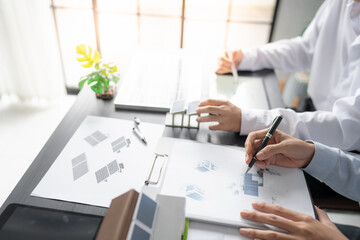 Solar panels green energy Business man working green eco friendly office business creative idea Planing Bio economy for business eco friendly professional Engineer sustainable electricity.