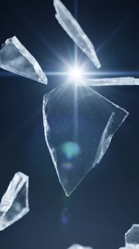 Floating shards of clear glass against a dark background creating a shattered effect