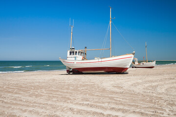 boats on a beach in denmark