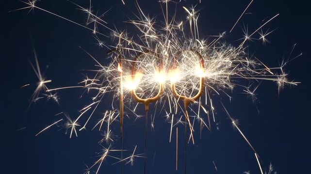 100 years anniversary celebration festive footage made with Bengal fire in the form of number One Hundred