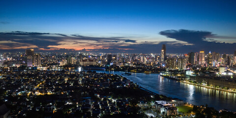 Fototapeta premium View of Phnom Penh, the capital of the Kingdom of Cambodia, at night. View from the Mekong River ban