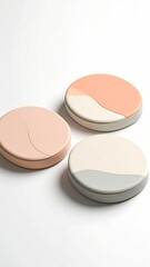 Three round, decorative trays in soft pastel colors.  Each tray features a subtle color gradient, flowing smoothly from one shade to another.  The gradient is visually pleasing