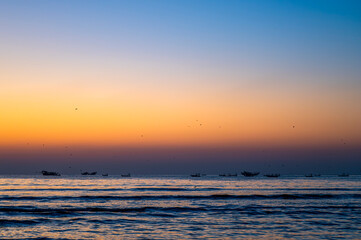 Traditional Omani Fishing Dhows Silhouetted Against Sunrise, Al Khaluf, Oman