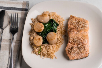 baked salmon with brown rice and scallops