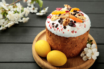 Traditional easter cakes with colorful sprinkles, with eggs, a bunny figurine, and spring flowers, creating a festive holiday scene