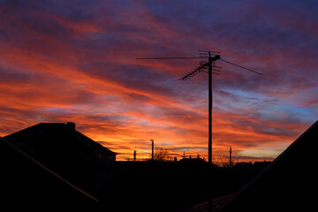 Dramatic sunset and TV antenna