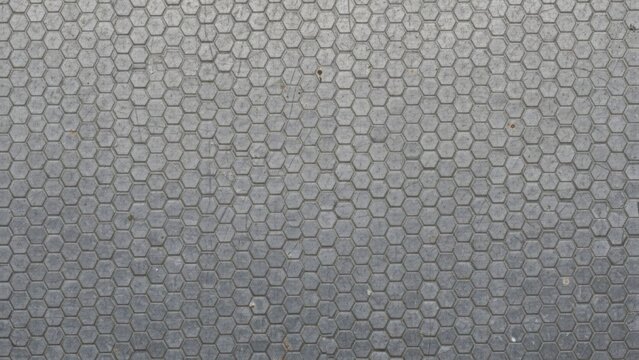 Dark gray rubber mat with small hexagonal texture