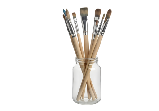Collection of paint brushes in a glass jar isolated on transparent background